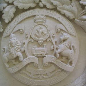 Carved-Crests-of-Gothic-Revival-Fireplace,-Surrey