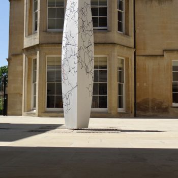 Memorial-to-John-Kendrew,-in-Carrara-marble-with-inlaid-lead-and-colored-resin,-St-Johns-College-Oxford